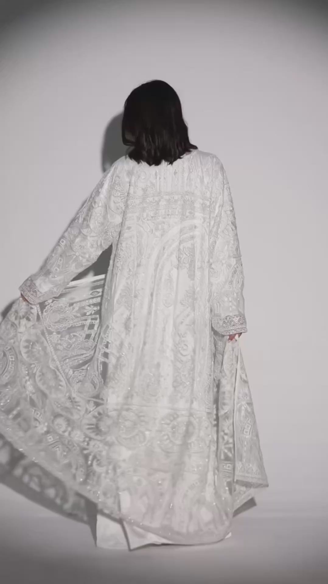Video of a model cat walking with a luxury bridal abaya