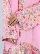 Close-up of RUMI pink floral abaya sleeve, highlighting vibrant flower print and soft chiffon sheila